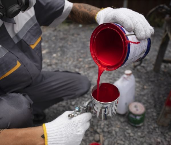 high-angle-man-pouring-paint