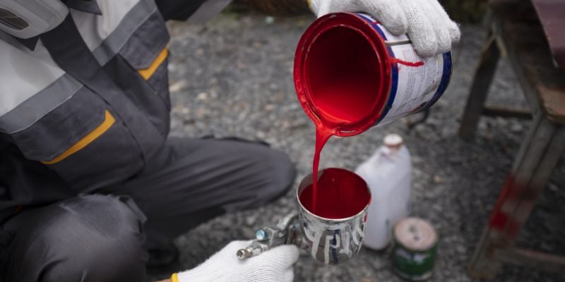 high-angle-man-pouring-paint